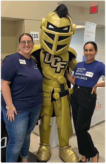 Team members with the UCF Knight mascot