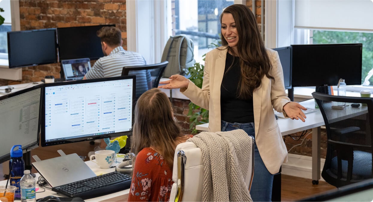 Rocketeers collaborating at a desk