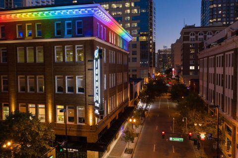 Launch That building with rainbow lights at dusk